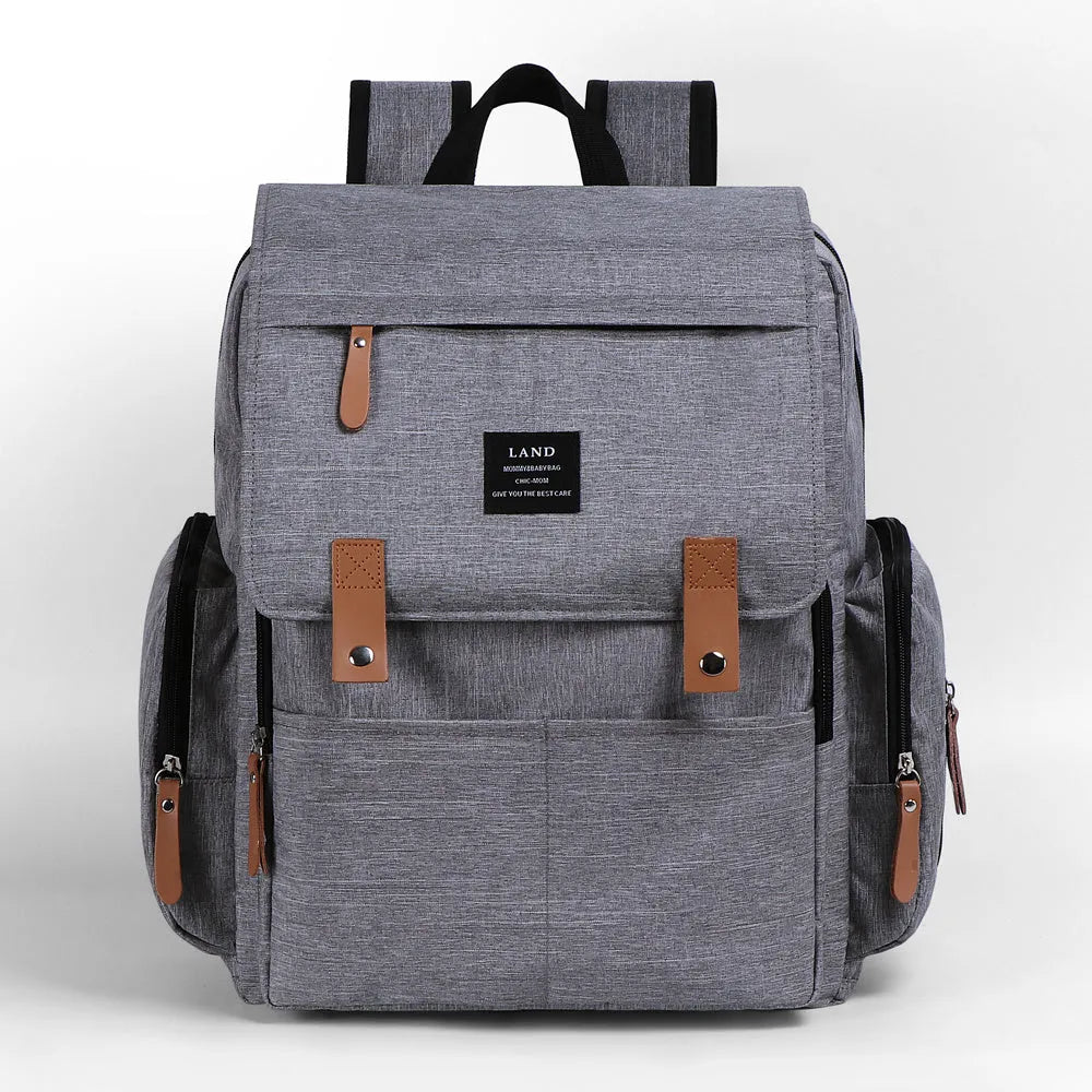 Large Oxford cloth diaper backpack with changing mat in beige colour, dimensions 33x39x15cm