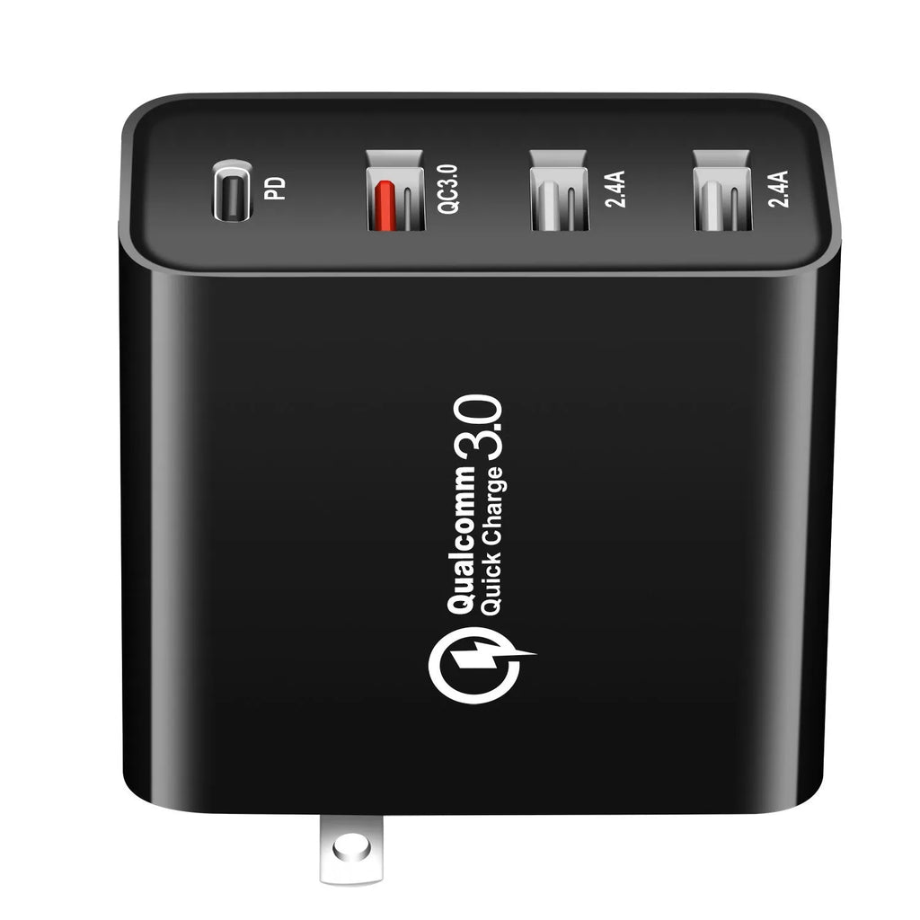 Black four-port USB-C wall charger with UK plug adapter and international travel plugs