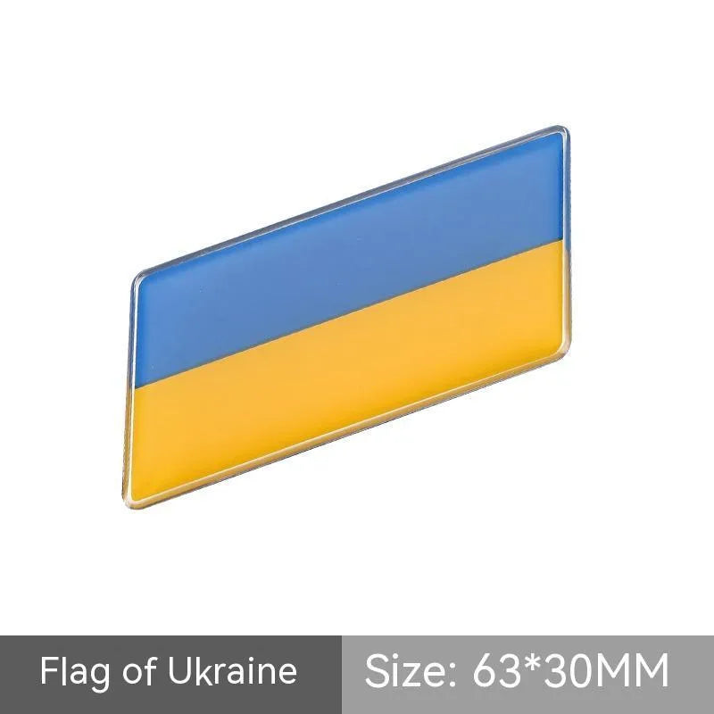 Aluminium metal car sticker with national flag design in a parallelogram shape.