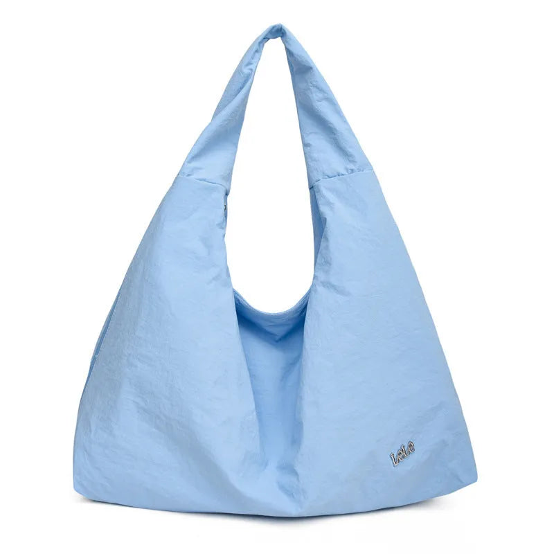 Heart-shaped soft nylon crossbody bag for women in black, blue, khaki, or yellow.