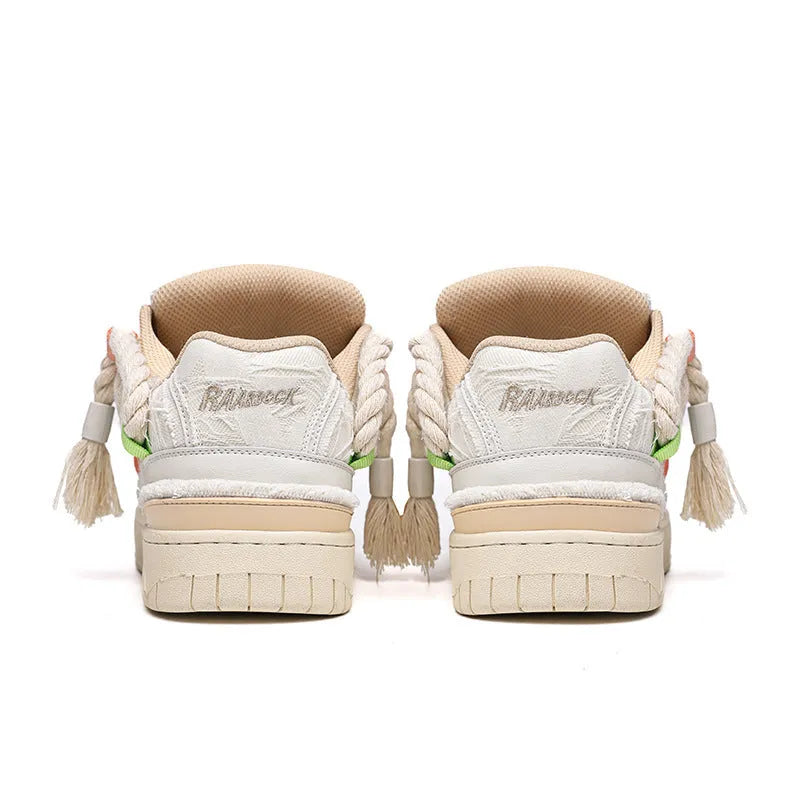 Creamy white low-top retro skate shoes with lace-up front and platform sole.
