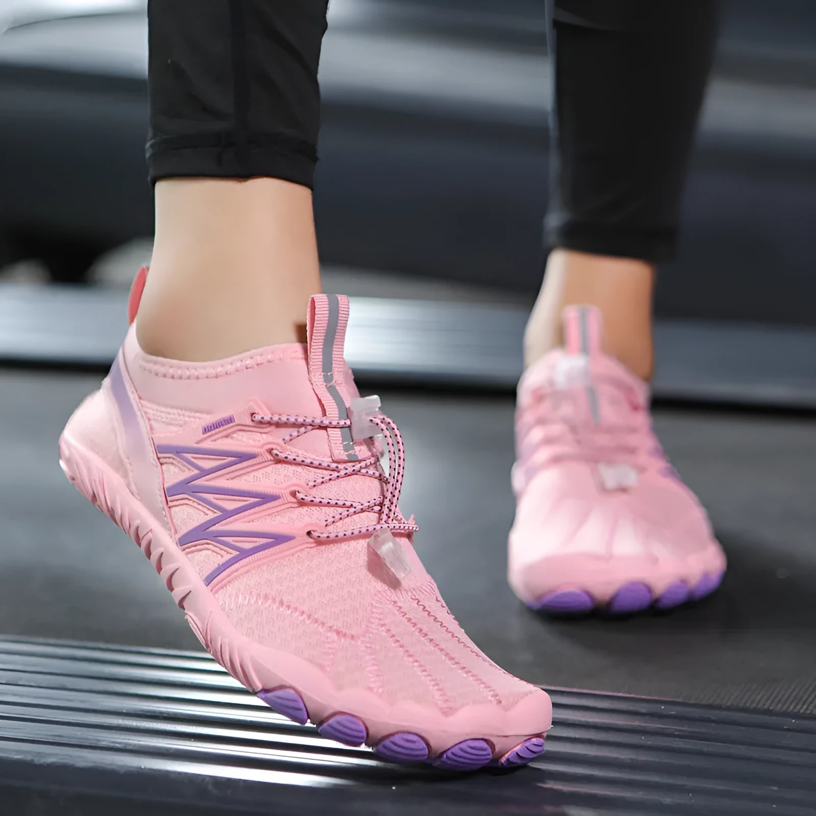 Indoor fitness training sneakers in multiple colours with striped pattern and rubber sole.