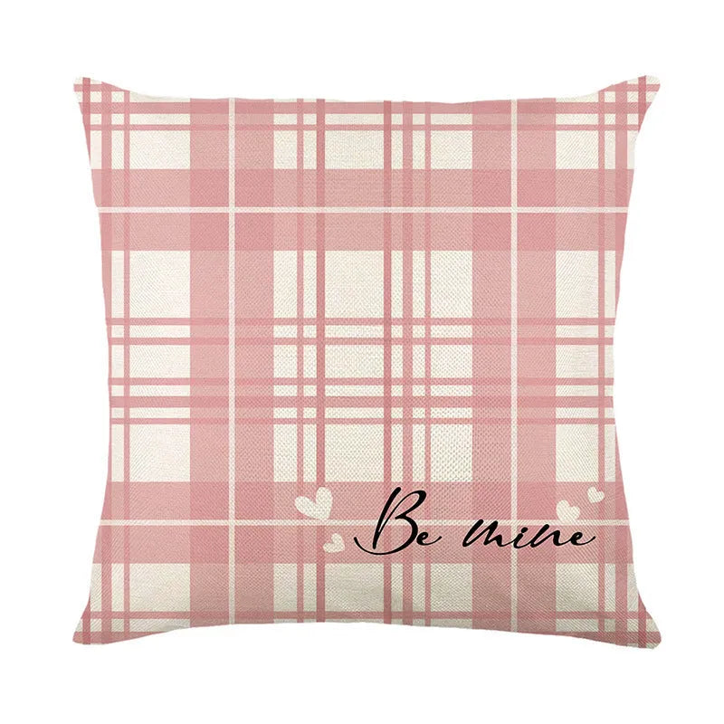 Square red and white plaid heart print pillow cover on a sofa
