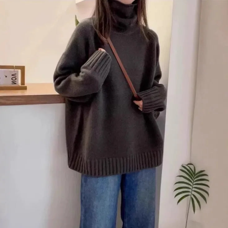 Women's loose fit turtleneck sweater in thick mesh polyester with curling pile collar