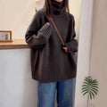 Women's loose fit turtleneck sweater in thick mesh polyester with curling pile collar