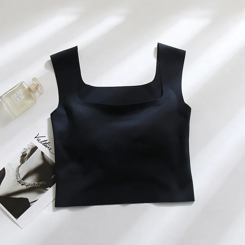 Women's non-marking nylon sling vest with chest pad in light blue, showing seamless beauty back design.