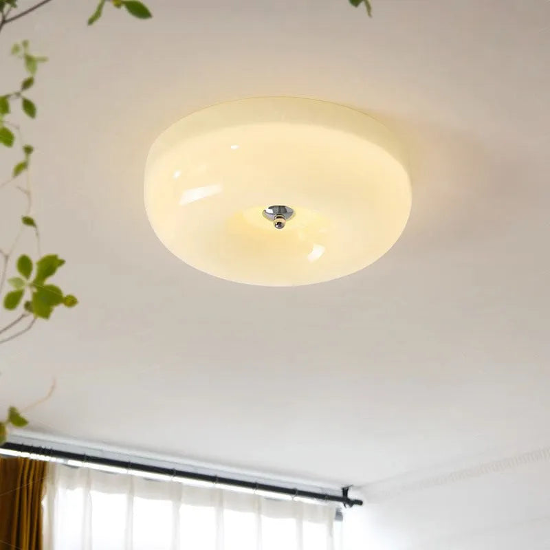 Cream coloured American style bedroom ceiling light with a three-colour lighting system.