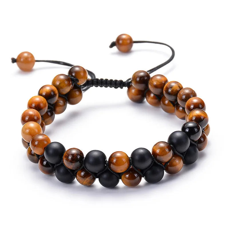 Pair of matte black agate bead bracelets with geometric design for couples.