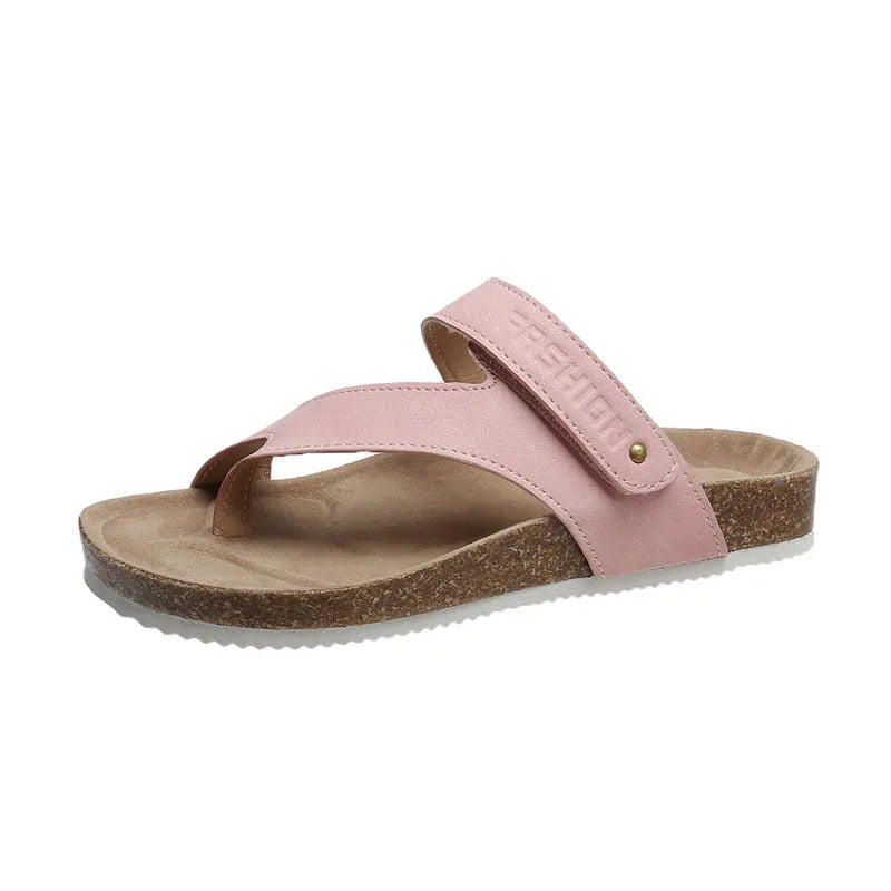 Flat toe ring thick-soled flip-flops in a solid colour on a light background