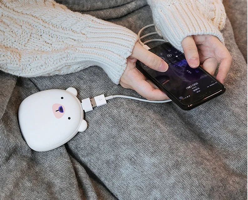 Cartoon penguin and polar bear USB rechargeable hand warmers showing front design