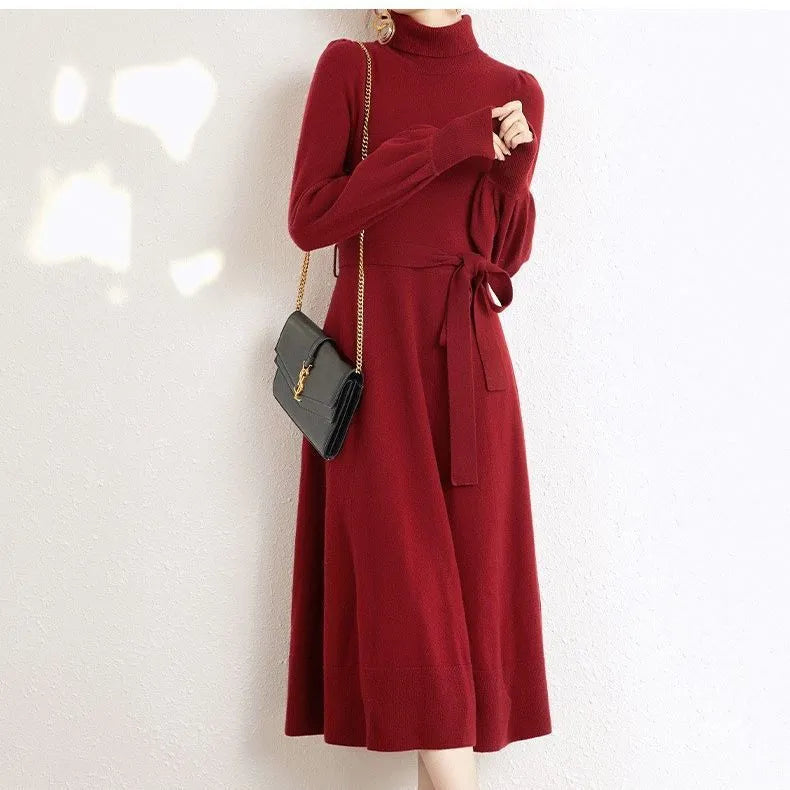Women's turtleneck long sleeve knit dress in loose fit with big hem and elastic waist.