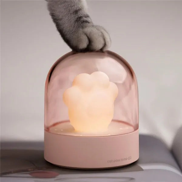 Grey cat paw shaped USB rechargeable night light with rotating musical display