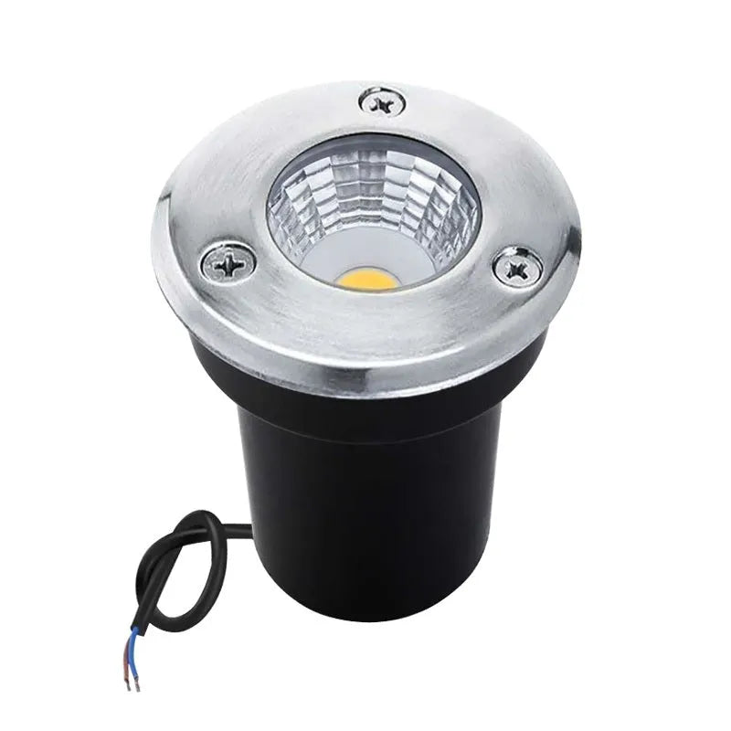 Black round LED COB underground light for outdoor garden and pathway illumination.
