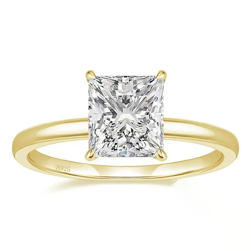 Simple geometric 925 silver ring in silver, gold, and rose gold colours on a plain background.