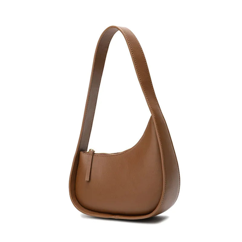 Genuine leather half moon women's handbag with wide shoulder strap in caramel colour