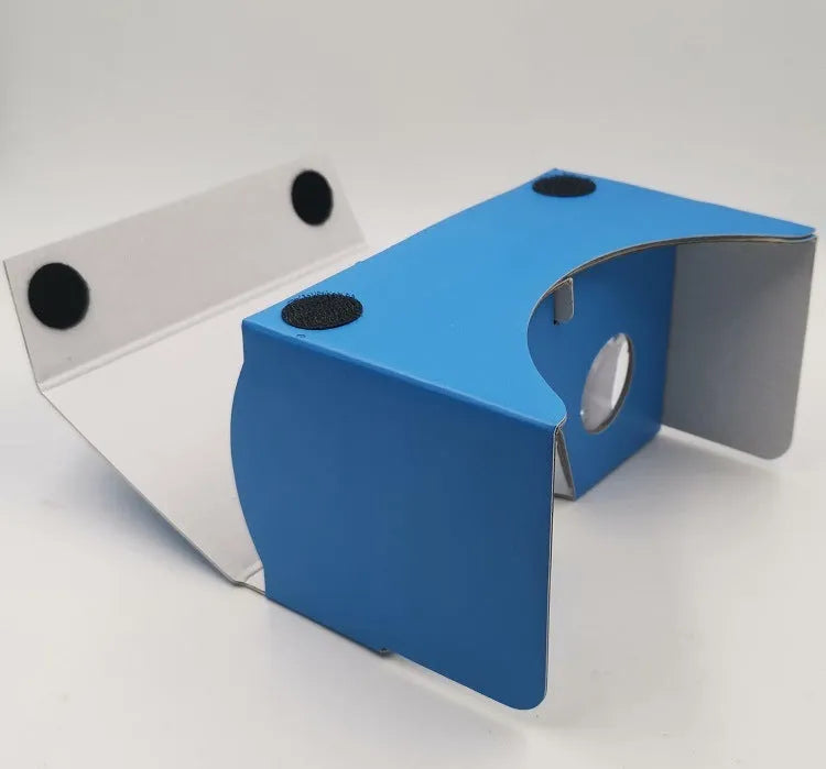 Pink and white cardboard VR glasses for smartphones with head strap and 3D lenses.