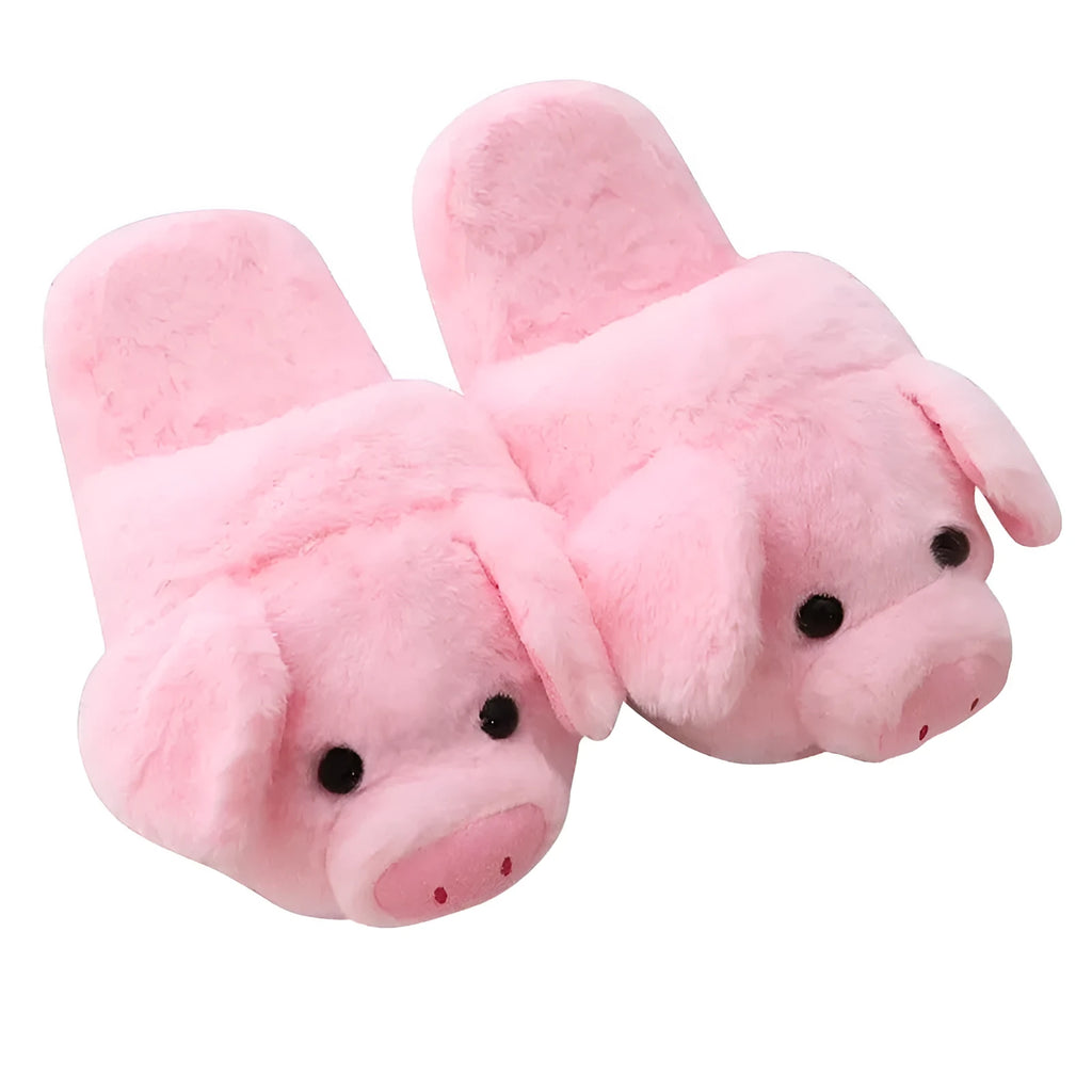 Pink pig-shaped plush slippers for adults on a white background.
