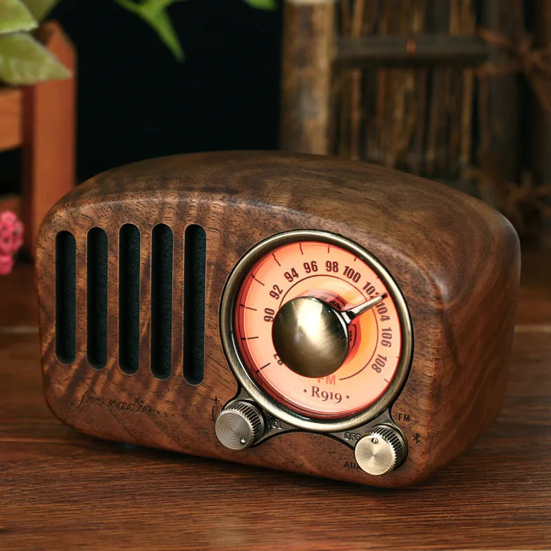 Retro wooden wireless mini speaker in cherry wood finish showing front and side.