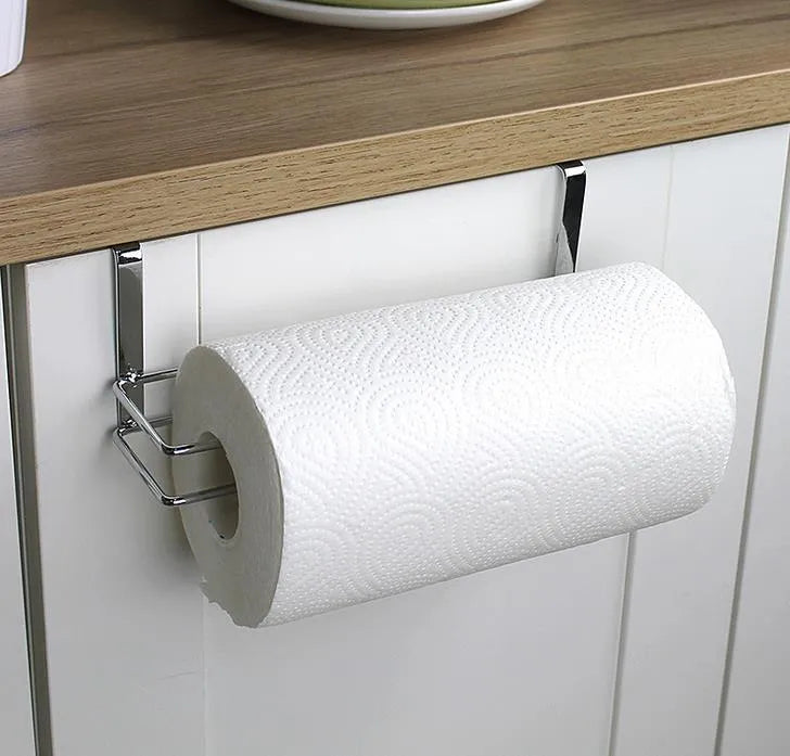 Silver stainless steel kitchen towel rack mounted on a white cabinet door.