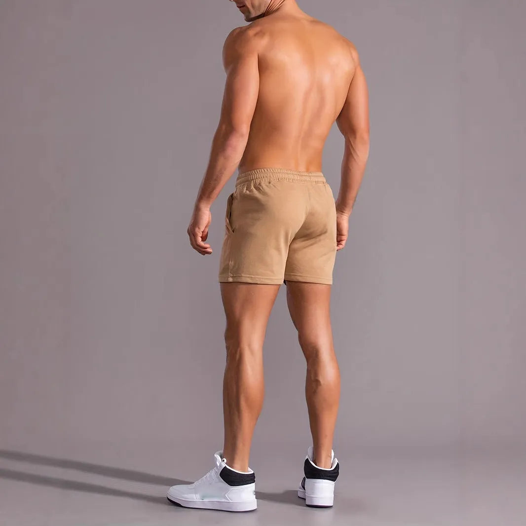 Men's khaki coconut printed sports shorts with elastic waistband and straight leg design