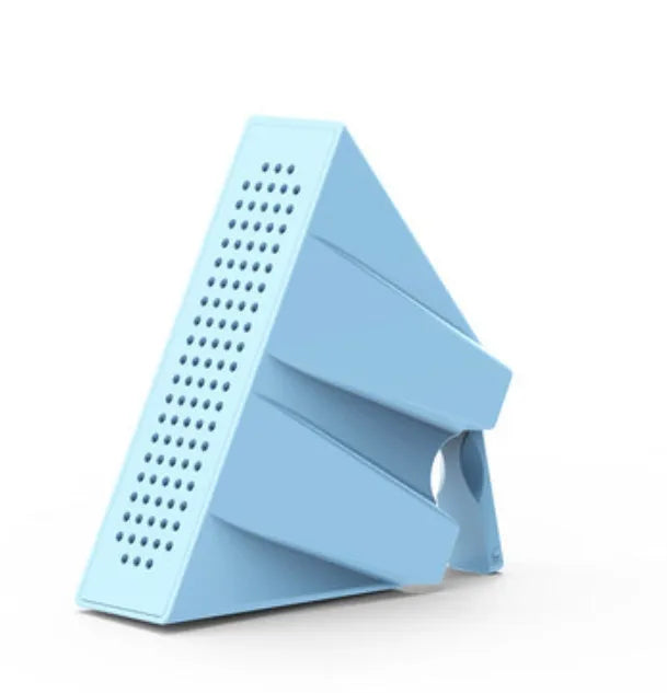 A portable black ABS plastic phone amplifier holder on a desktop, showing a mobile phone inserted for sound amplification.