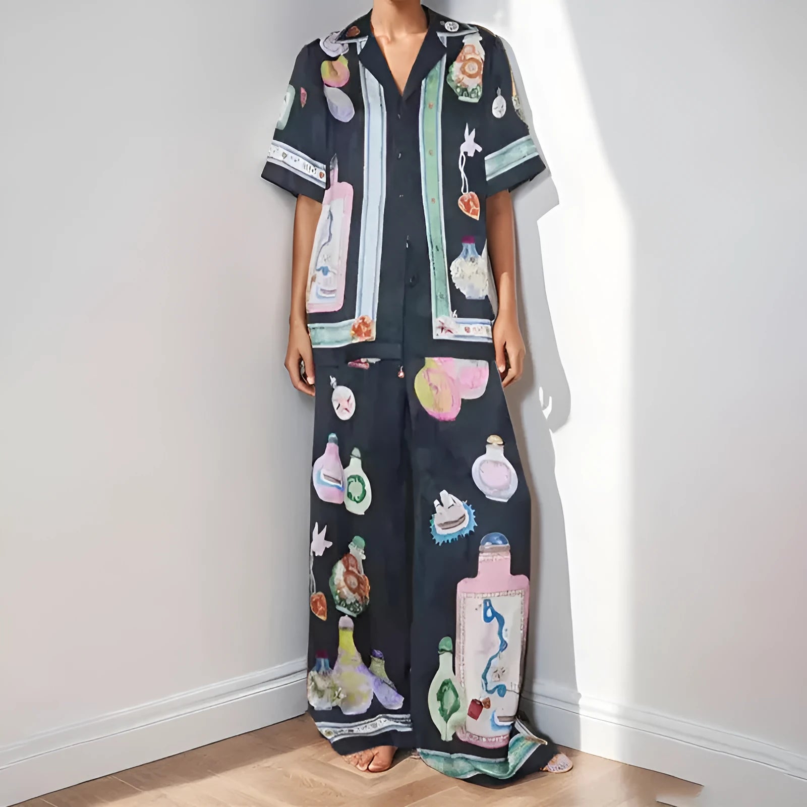 Black women's cartoon print casual set with cardigan and matching trousers