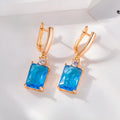Square geometric copper earrings with gold electroplated finish showing quadrilateral shape
