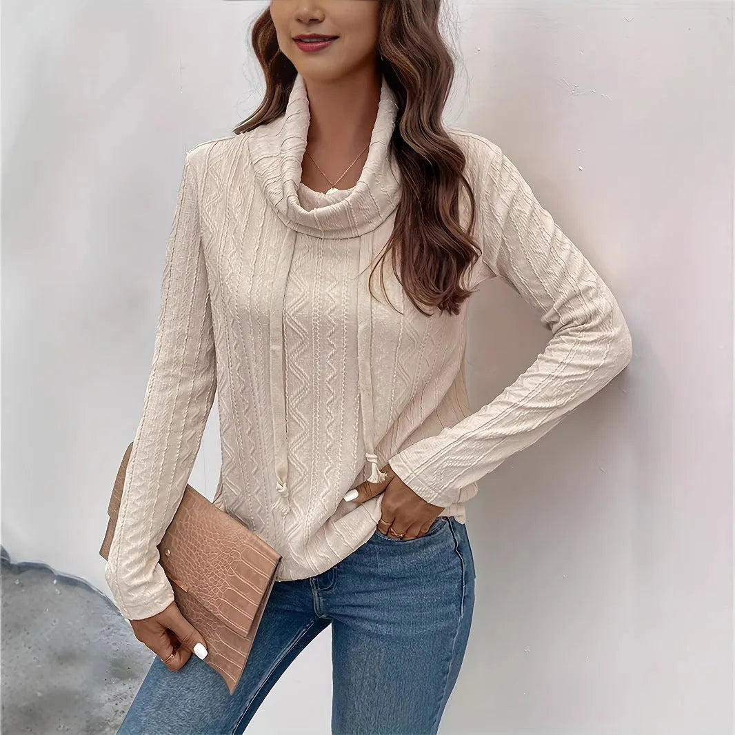 Apricot coloured long sleeve hooded pullover sweater with drawstring closure