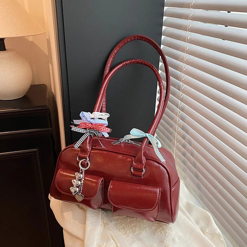 Retro women's pillow bag in PU leather with double shoulder straps and flap closure