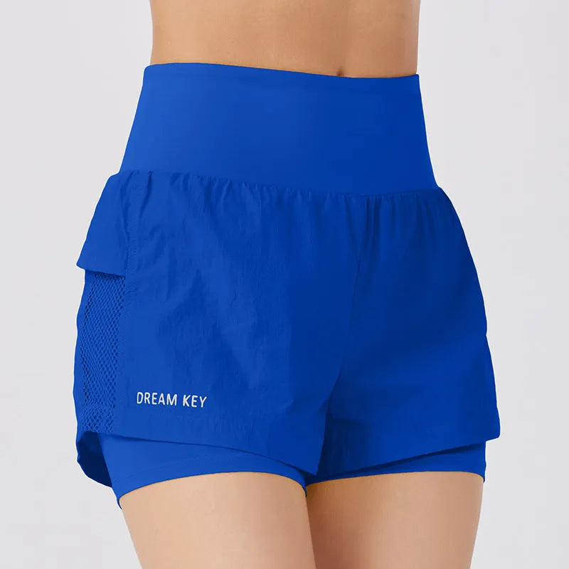 Women's loose casual quick-drying sports shorts in cotton blend fabric on a hanger.