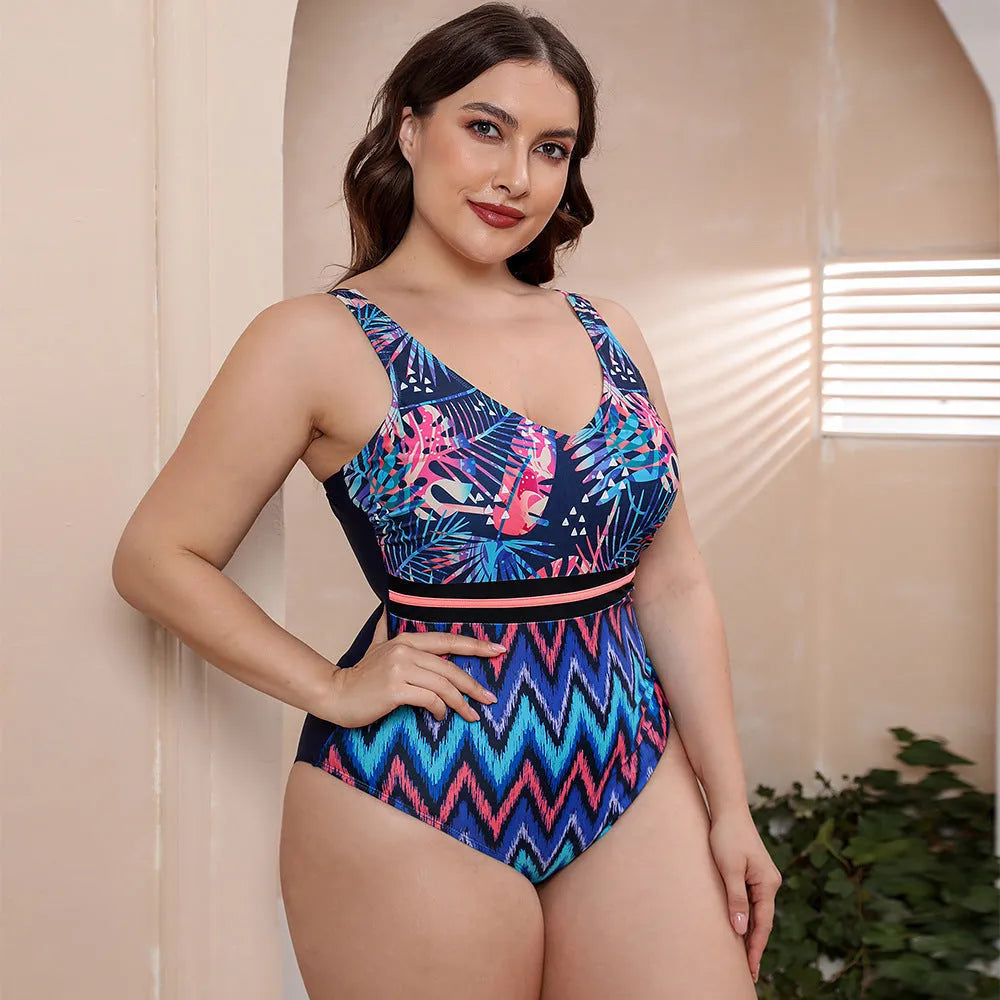 Women's blue printed one-piece swimsuit with spaghetti straps and a striped vest design