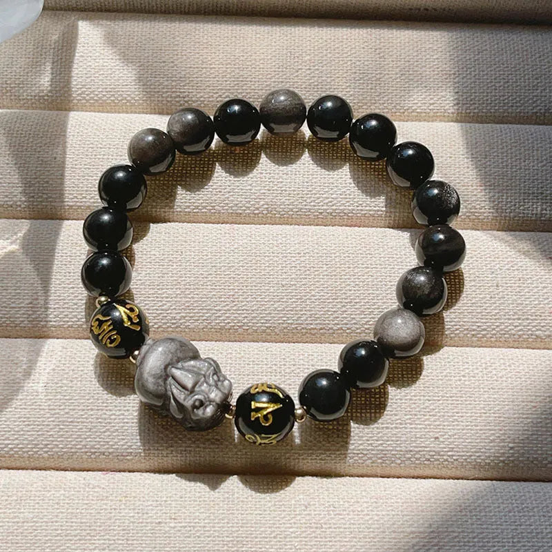Man's Silverstone beaded bracelet with engraved Chinese proverbs and zodiac symbols.