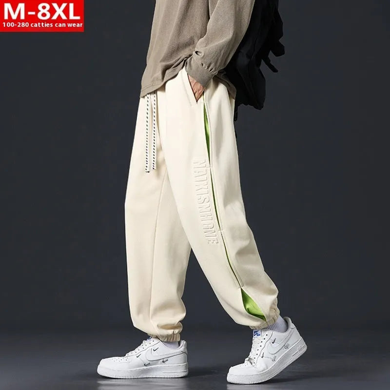 Men's loose fit trousers with stitching printing detail and banded ankle cuffs in micro elastic cotton fabric