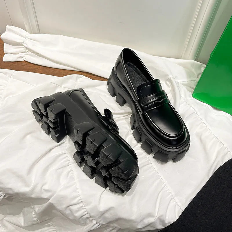 British style wide fat foot loafers in patent leather and matte finish, showing rubber sole and slip-on design.