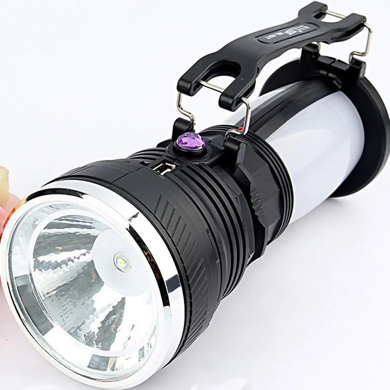 Black solar-powered LED flashlight with USB charging port on a durable ABS plastic body.
