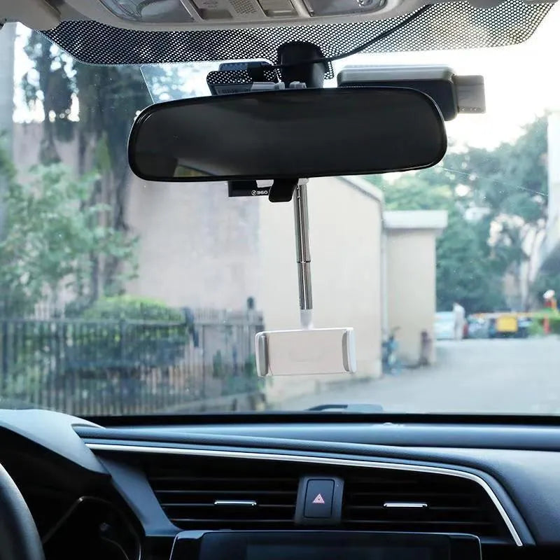 Black vehicle rearview mirror phone bracket showing adjustable arm and clip mechanism