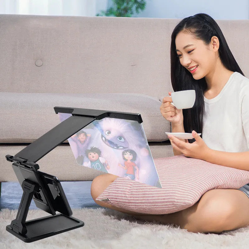 Black L20 split mobile phone screen magnifier with 12-inch acrylic lens and adjustable phone bracket on a table.