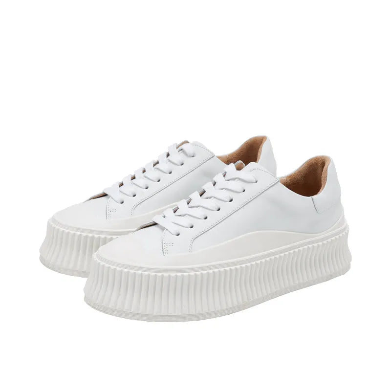 Women's thick sole platform sneakers with suede leather upper and cross-lace detailing
