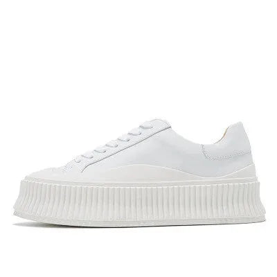 Women's thick sole platform sneakers with suede leather upper and cross-lace detailing