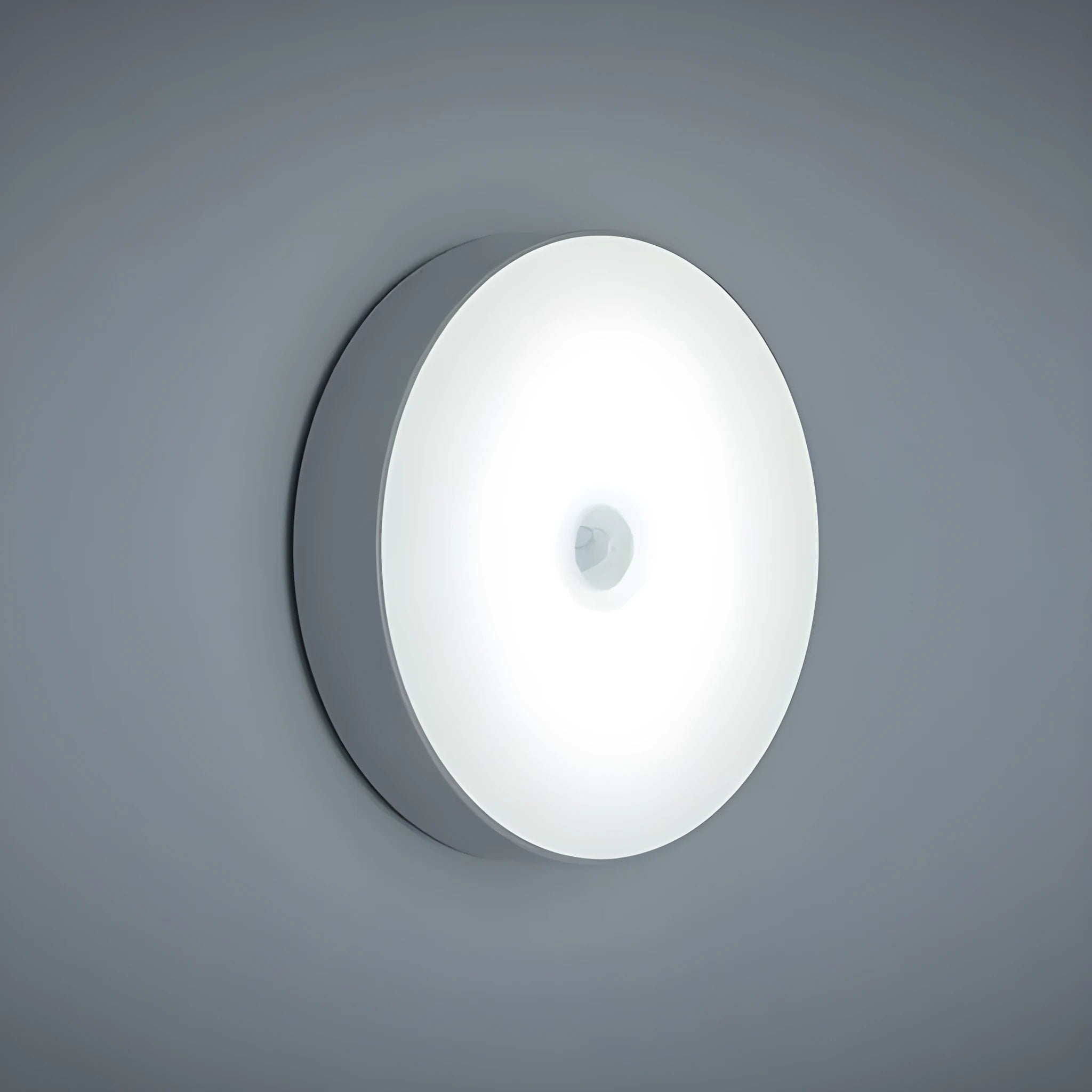 Compact beige motion sensing LED night light with USB charging port and adhesive backing