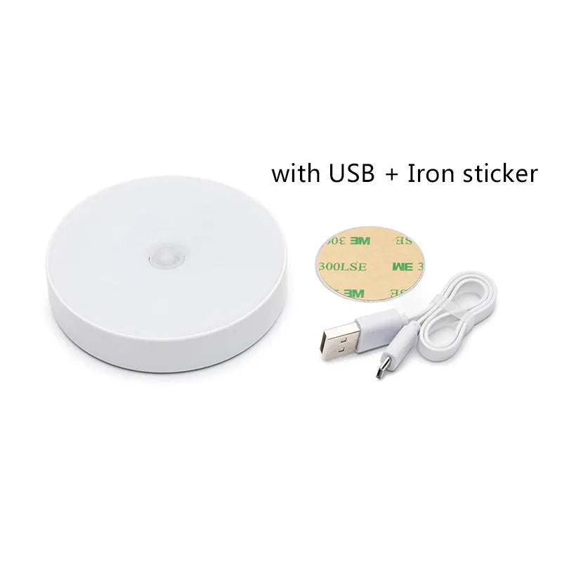 Compact beige motion sensing LED night light with USB charging port and adhesive backing