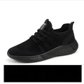 Men's black and white breathable mesh casual sport shoes with PVC sole and lace-up closure