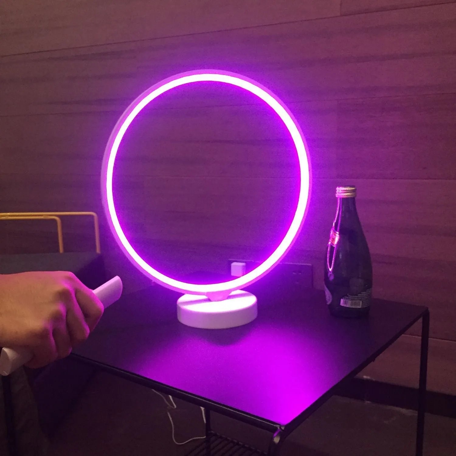 White Full Moon shaped LED table mood lamp with remote control on a wooden surface.