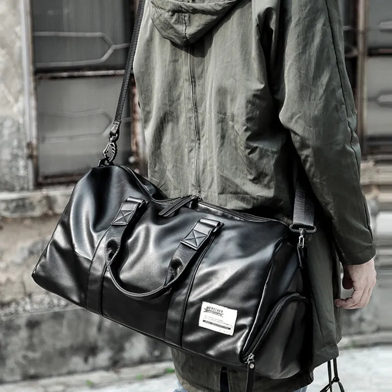 Large black waterproof PU leather sports training bag with a carry handle, shown open to reveal internal organiser pockets.