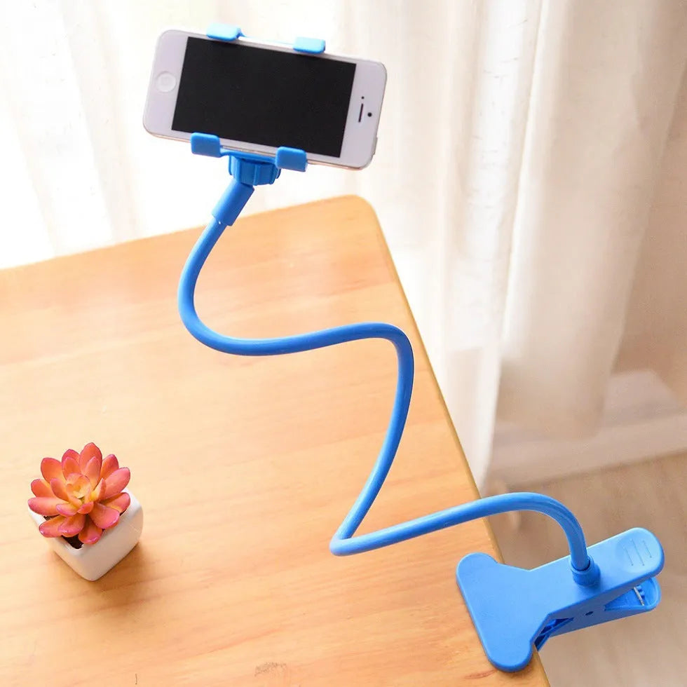 Black portable phone holder with long flexible arm and V-clip on a bedside table