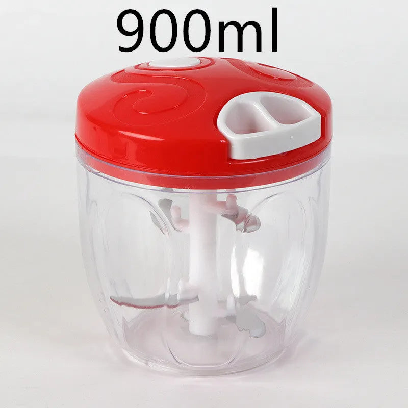 Green manual kitchen chopper with stainless steel blades and a clear lid, showing its compact size.