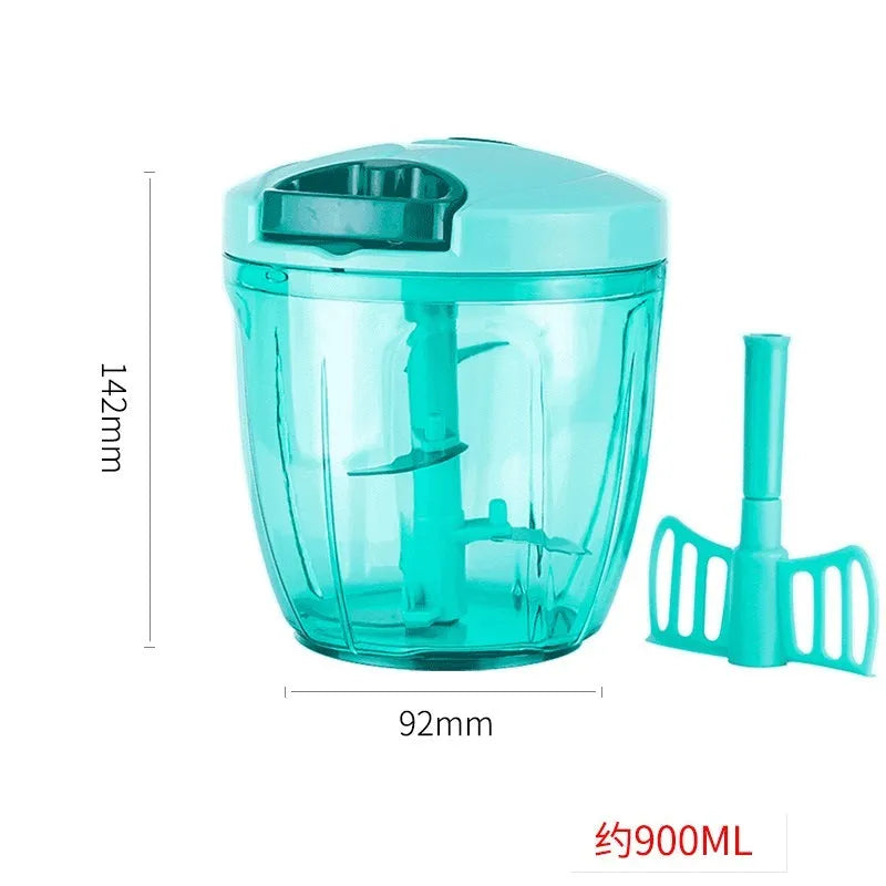 Green manual kitchen chopper with stainless steel blades and a clear lid, showing its compact size.