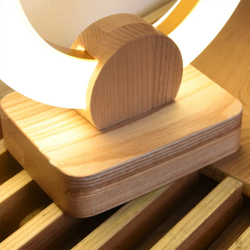 Nordic style wooden circular chandelier with acrylic shade and LED lighting in living room setting
