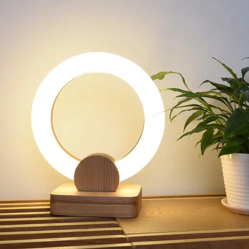 Nordic style wooden circular chandelier with acrylic shade and LED lighting in living room setting