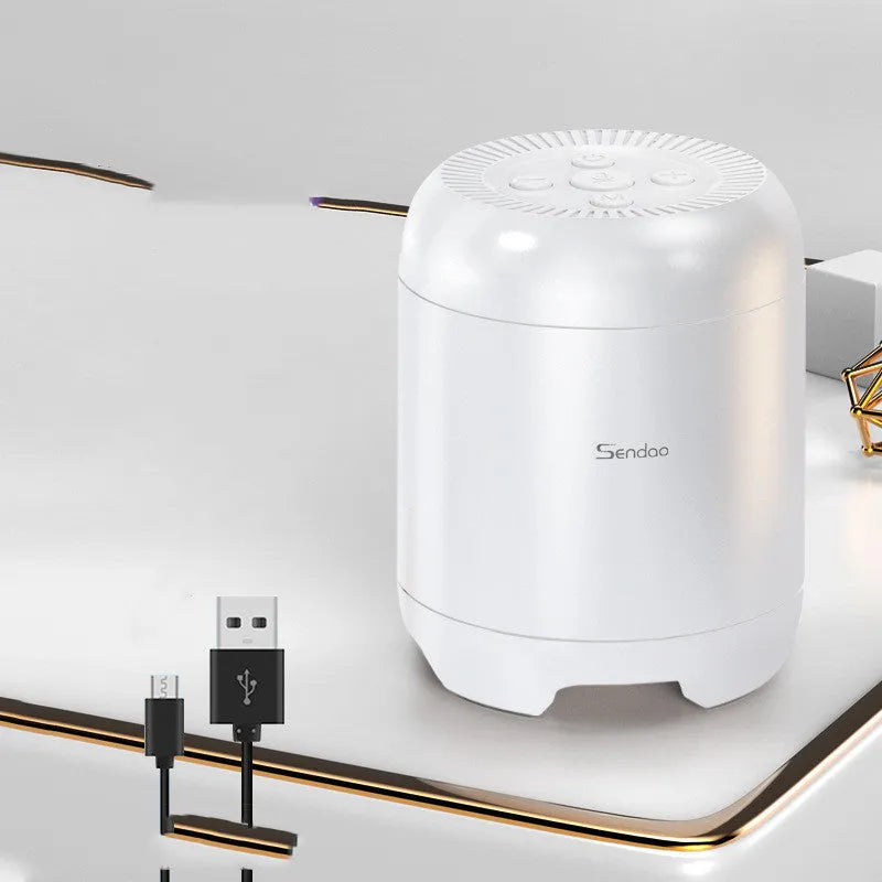 Compact black or white wireless Bluetooth speaker with subwoofer function and microSD card slot